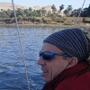 Me looking out from the felucca as we gently sailed down the Nile. There was a small amount of green life on either bank but then the desert resumed. It was pretty chilly until after midday!