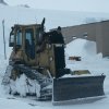 Chrissy J with his favourite bull-dozer after clearing snow for the South Pole evacuation flight.