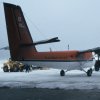 The Canadian Twin Otter being backed into the hangar after landing for the South Pole flight.